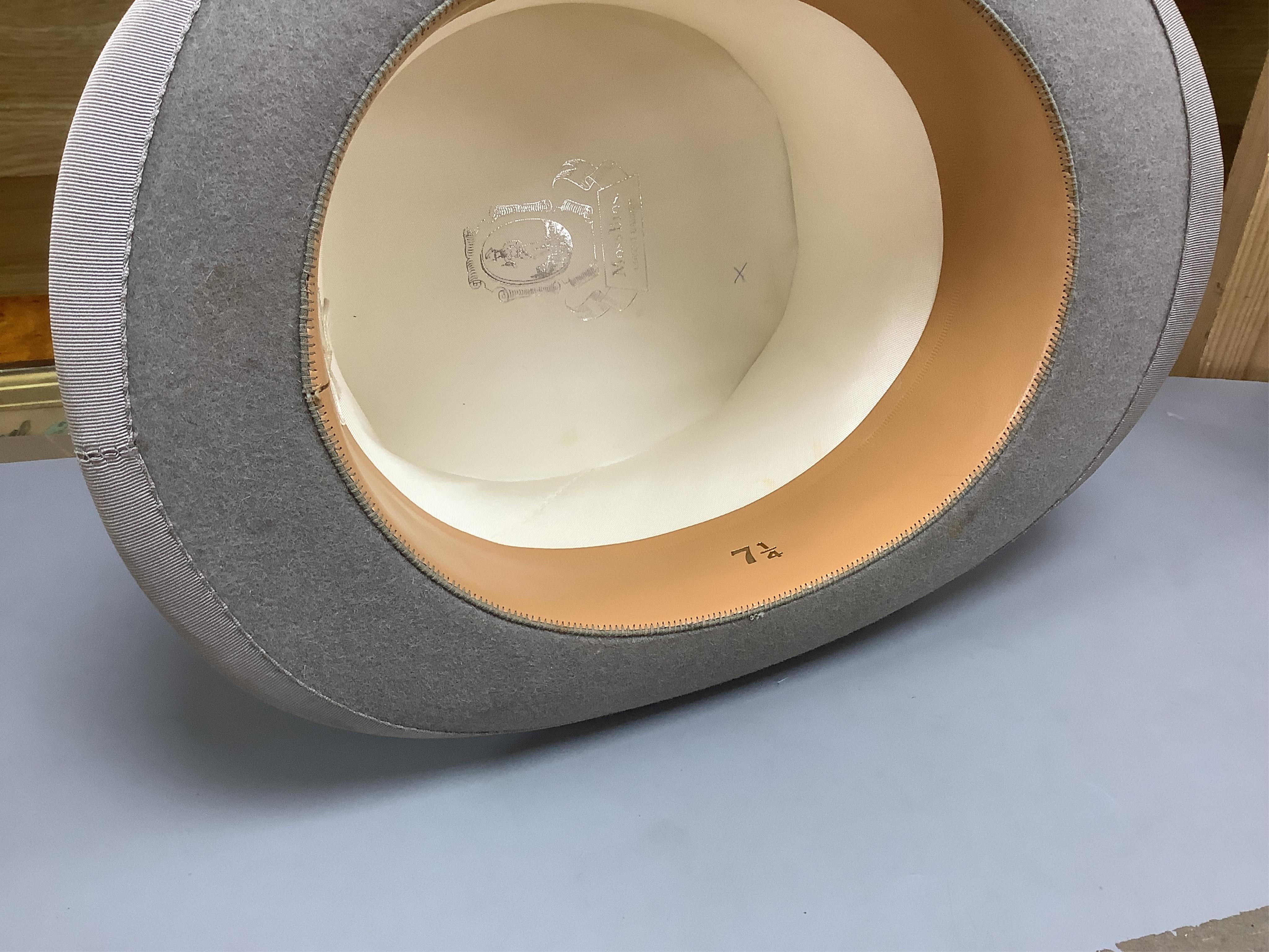 Three gentlemen’s black silk top hats and a similar grey top hat and box. Condition - grey hat good, others poor